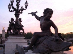 Charming and playful statue of a nymph riding a fish!