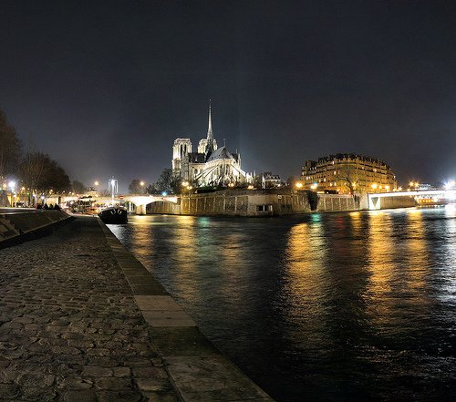Walking along the Seine after dark