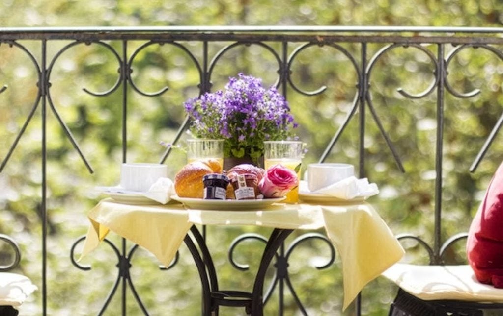 Petit déjeuner on the balcony of the Chambertin apartment.