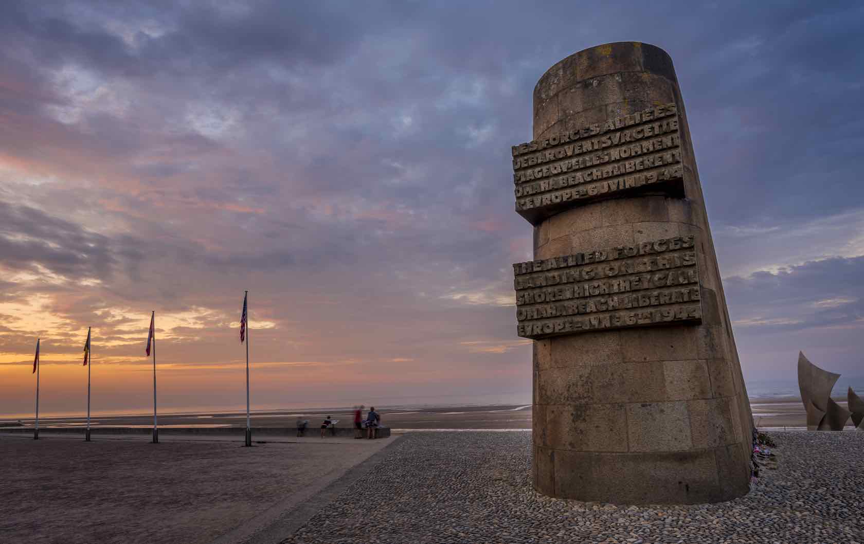 Here's Why You Should Visit France in 2019 by Paris Perfect Omaha Beach Normandy at Sunset