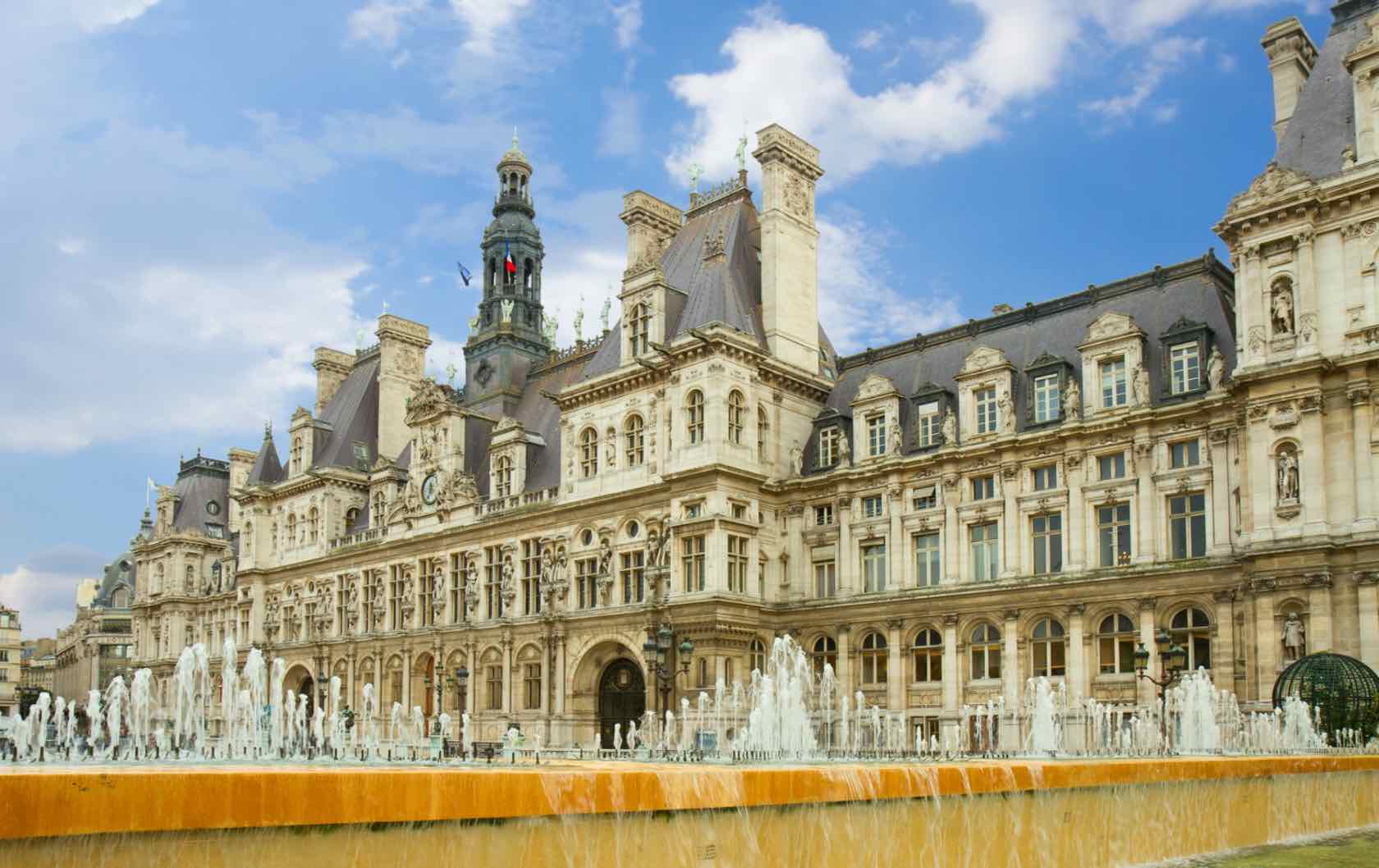 A red bouncy castle in the middle of a beautiful square in Paris