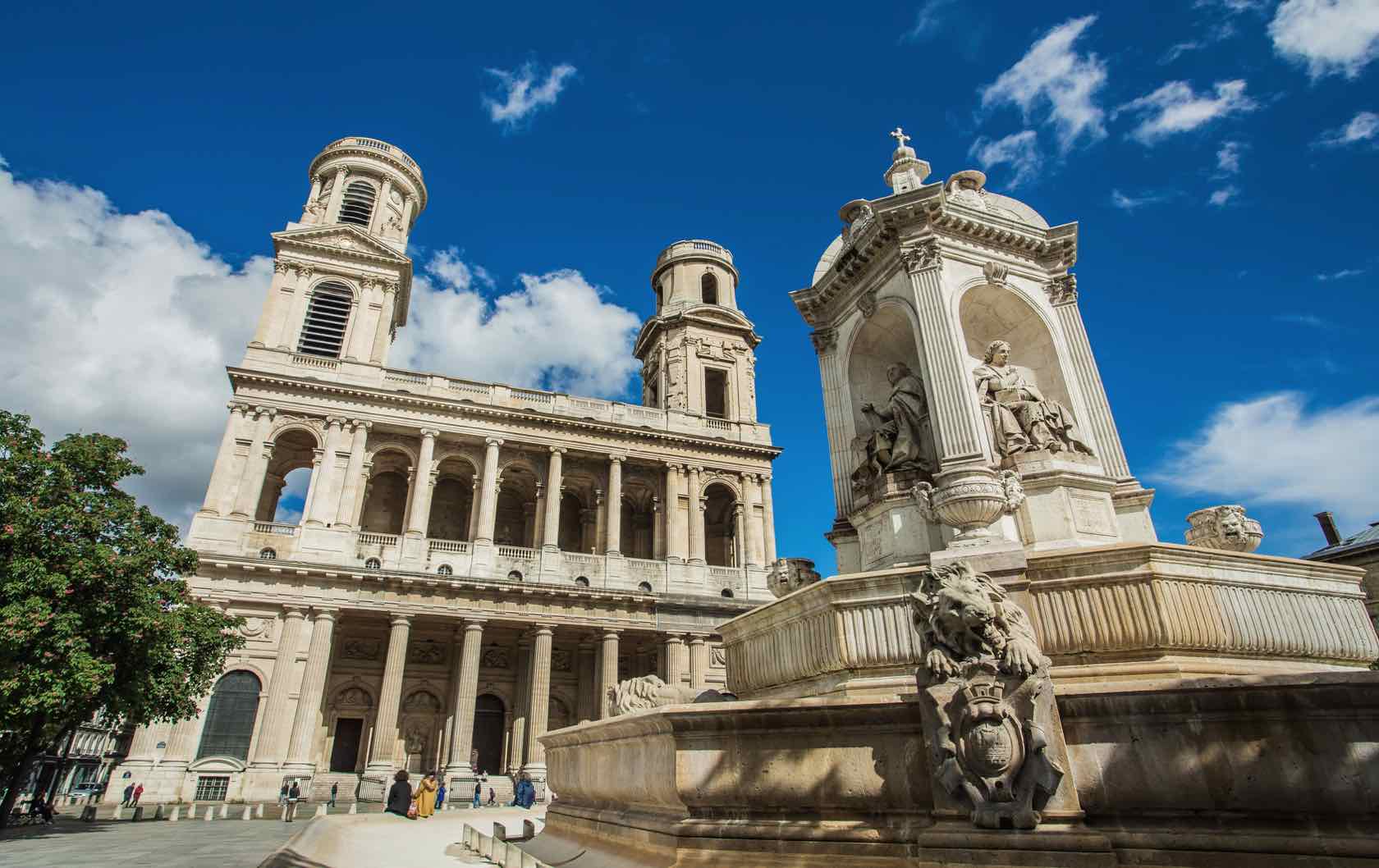 A red bouncy castle in the middle of a beautiful square in Paris