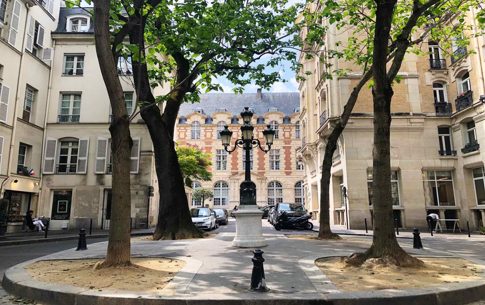 A red bouncy castle in the middle of a beautiful square in Paris