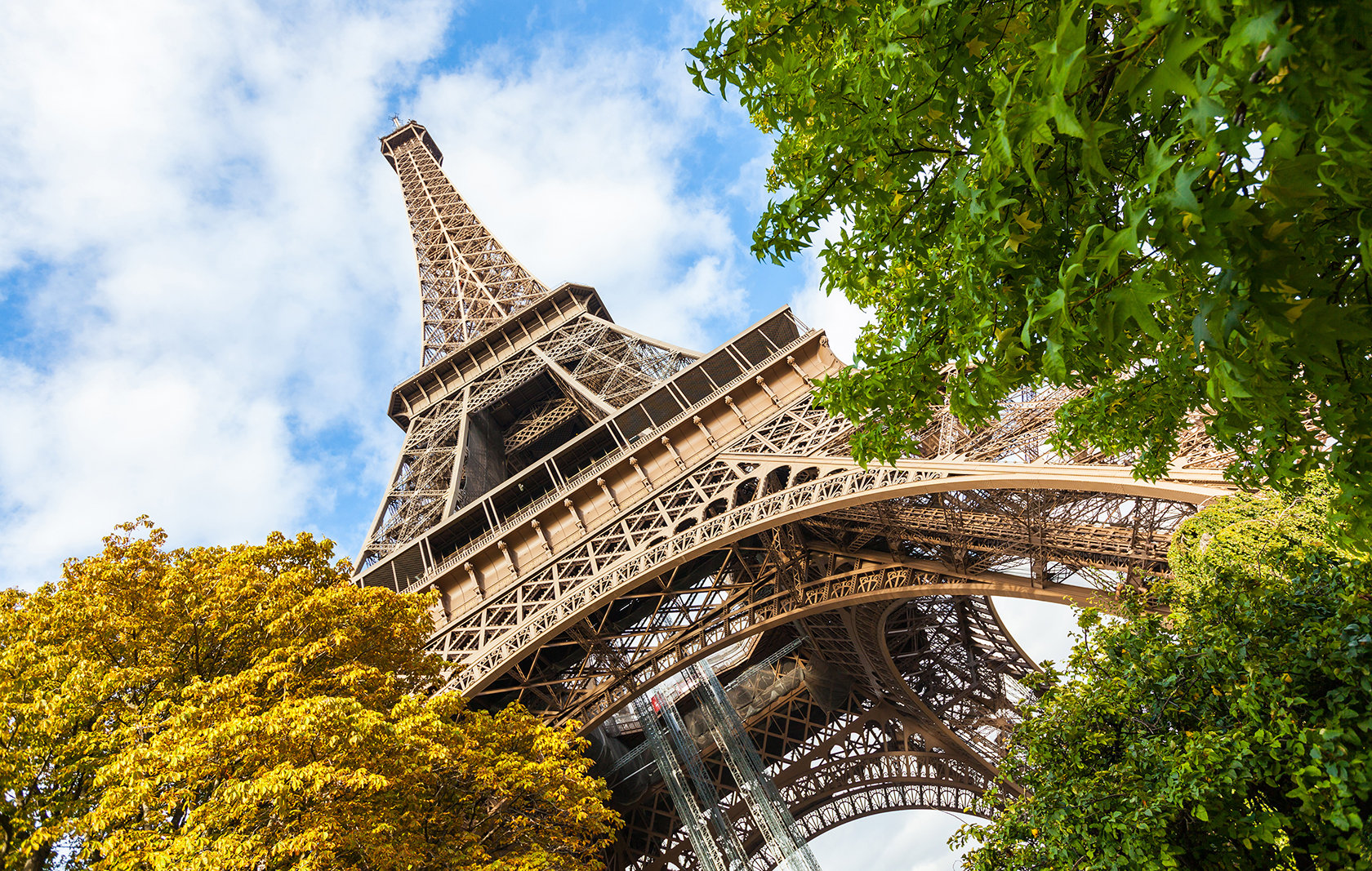 A close view from the base of the Eiffel Tower in Paris