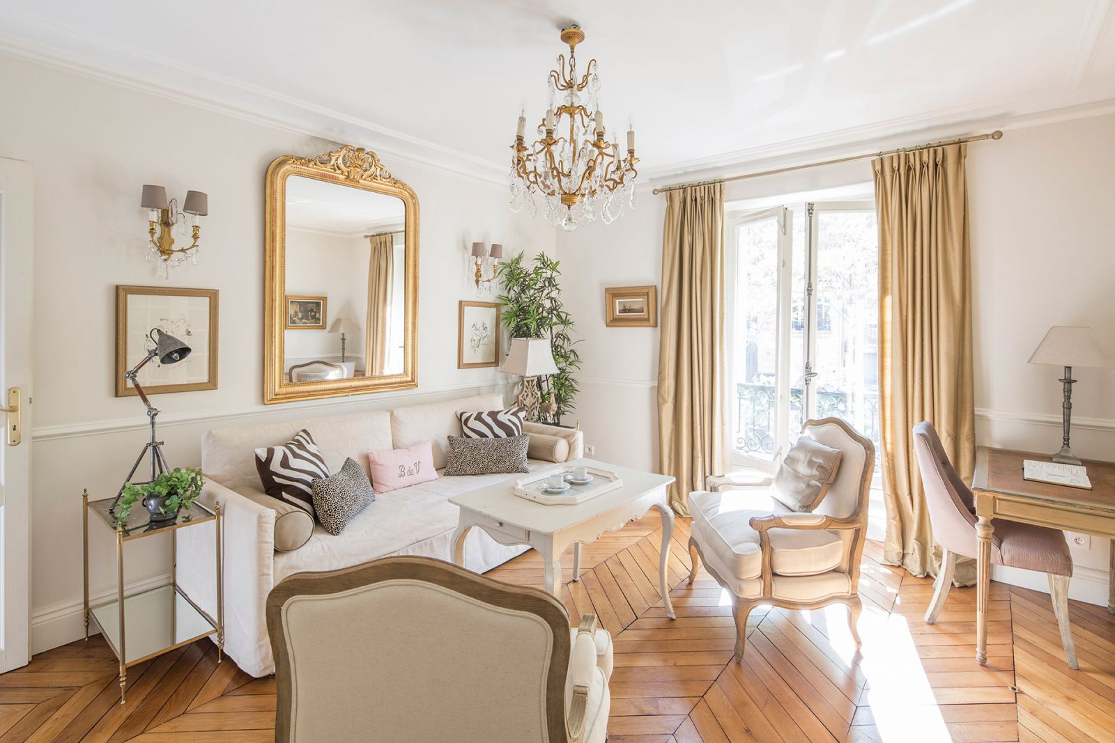 Sunny Parisian living room with comfortable sofa