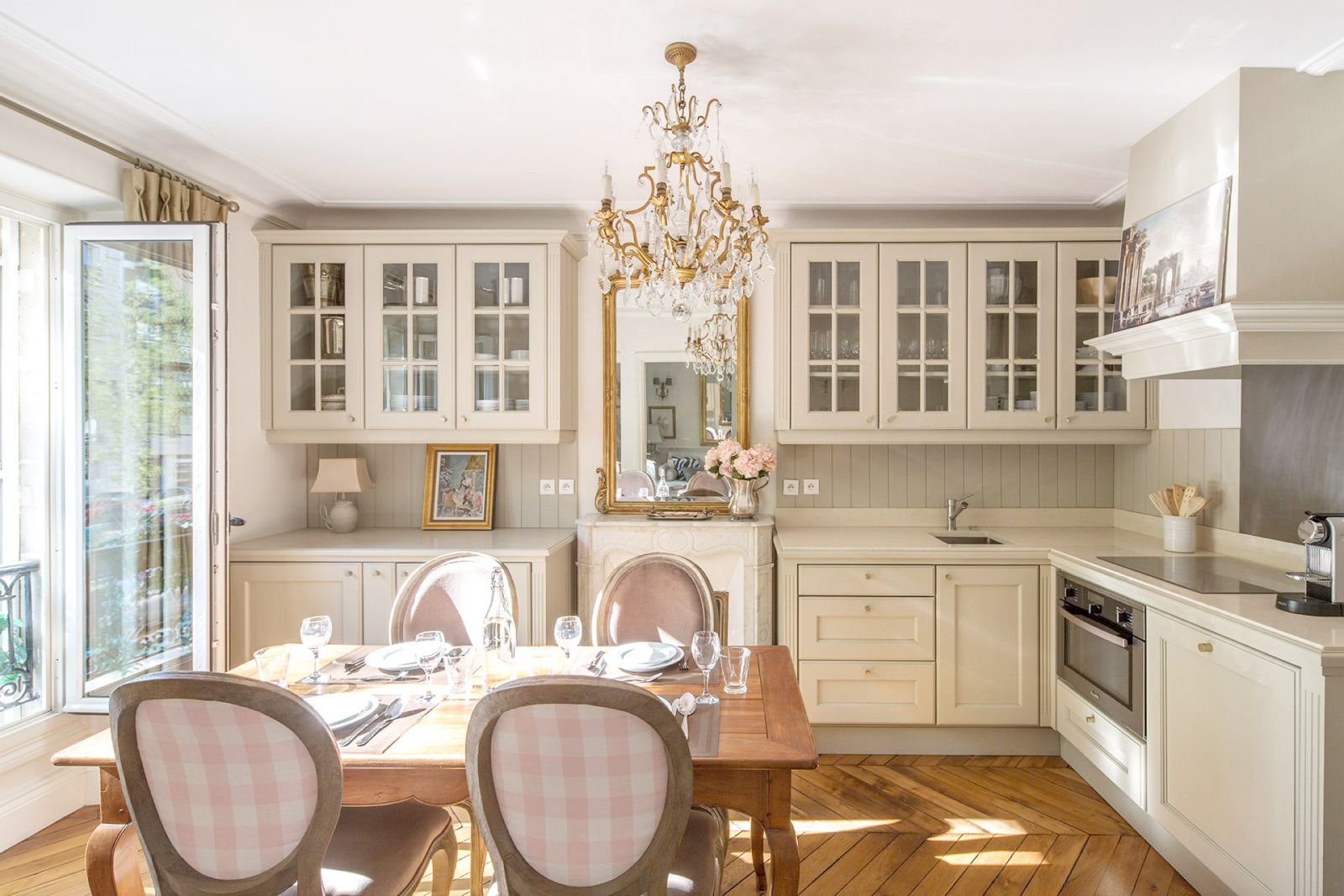 Kitchen overlooks a pretty tree-lined avenue in Paris