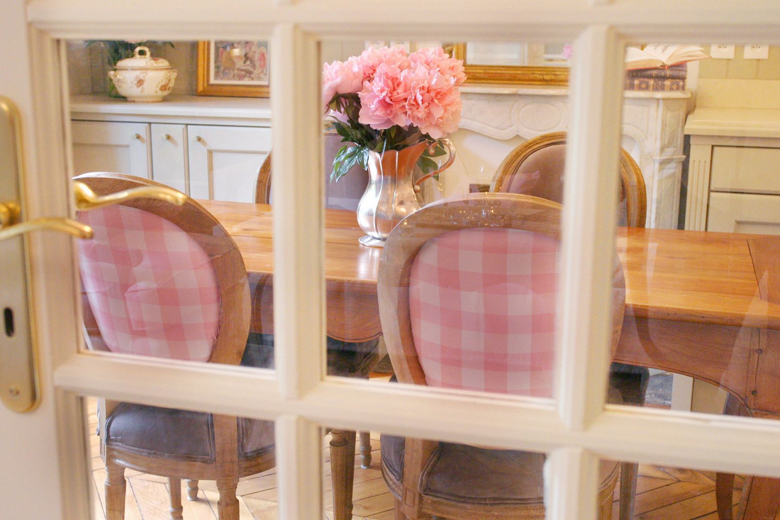 Peek through the French doors in the living room to the dining table
